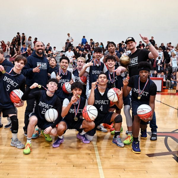 Team Impact Boys Basketball Posing With First Place Medals